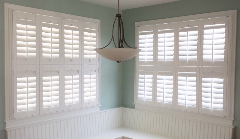 Soft green wall in Atlanta kitchen with shutters.